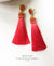 EDEN + ELIE silk tassel statement earrings - coral red